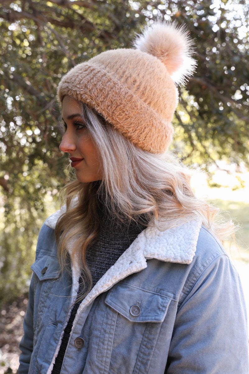 Soft Mohair Pom Beanie in a cozy winter setting, featuring a stylish pom on top and soft faux mohair fabric.