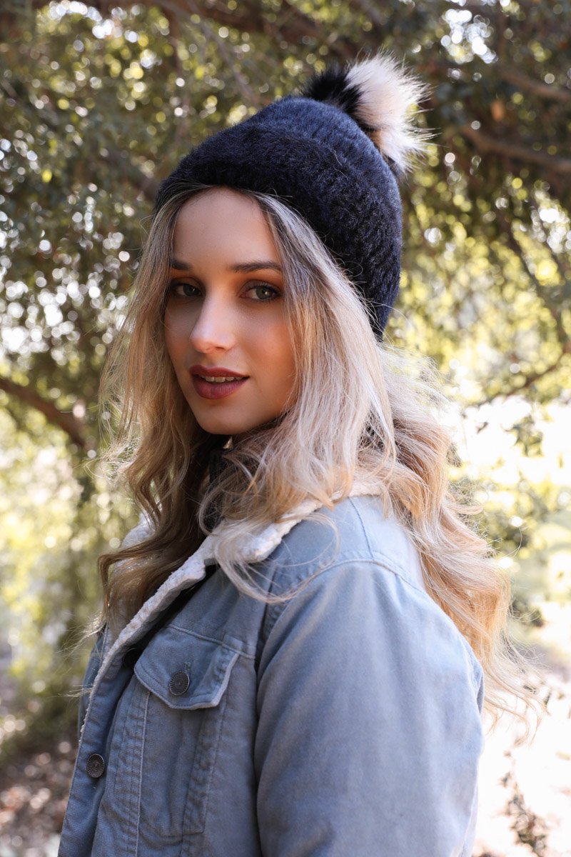 Soft Mohair Pom Beanie in a cozy winter setting, featuring a stylish pom on top and soft faux mohair fabric.