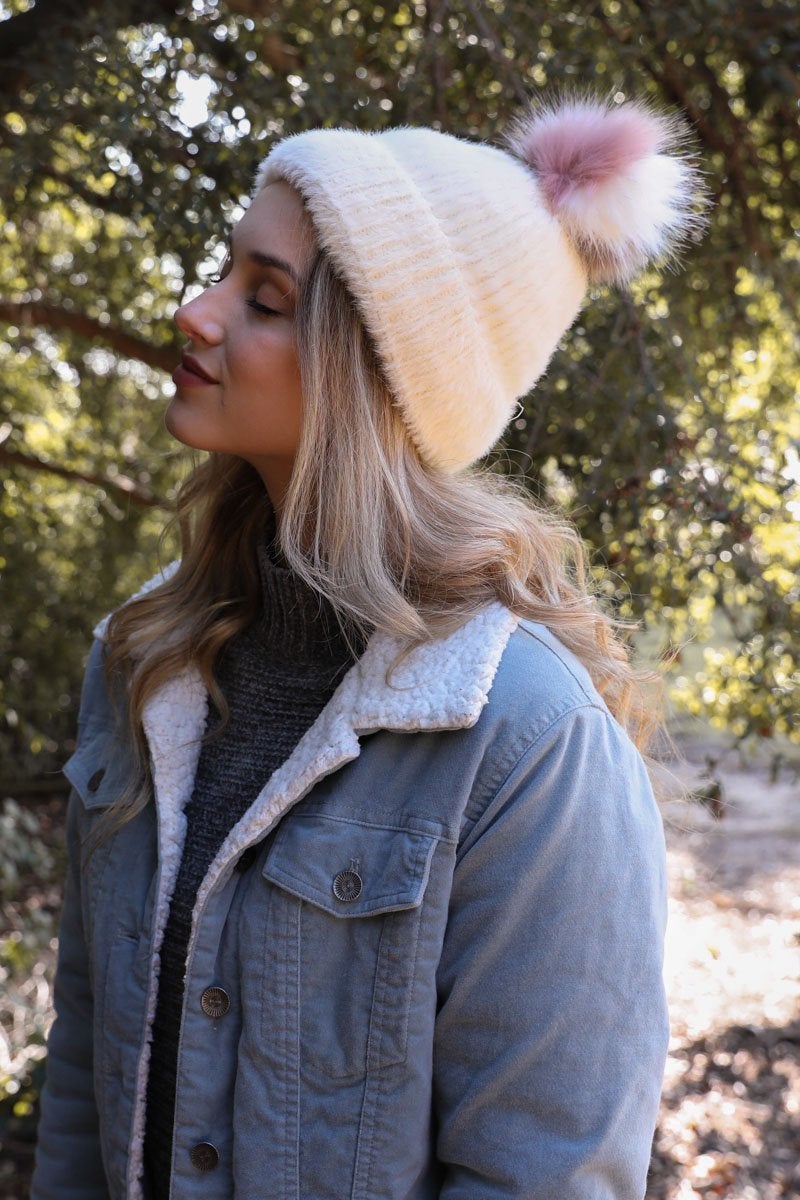 Soft Mohair Pom Beanie in a cozy winter setting, featuring a stylish pom on top and soft faux mohair fabric.