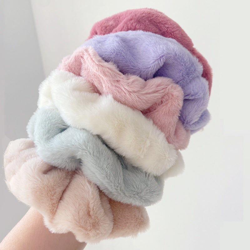 A set of 9 solid color plush hair ties in vibrant hues, showcasing their soft and fluffy texture, perfect for stylish hairstyles.