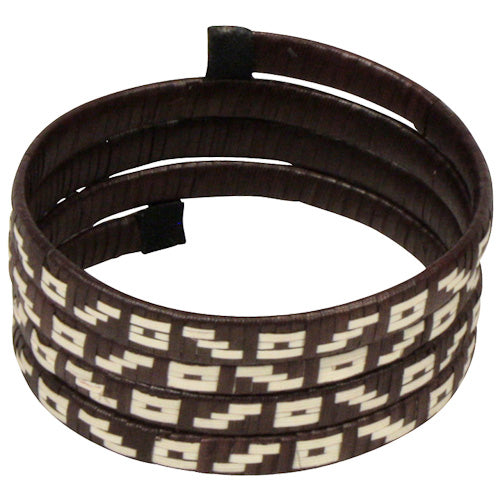 Spiral Cana Flecha Bracelet handcrafted from Caña Flecha plant, featuring intricate geometric patterns by Zenu Tribe artisans in Colombia.