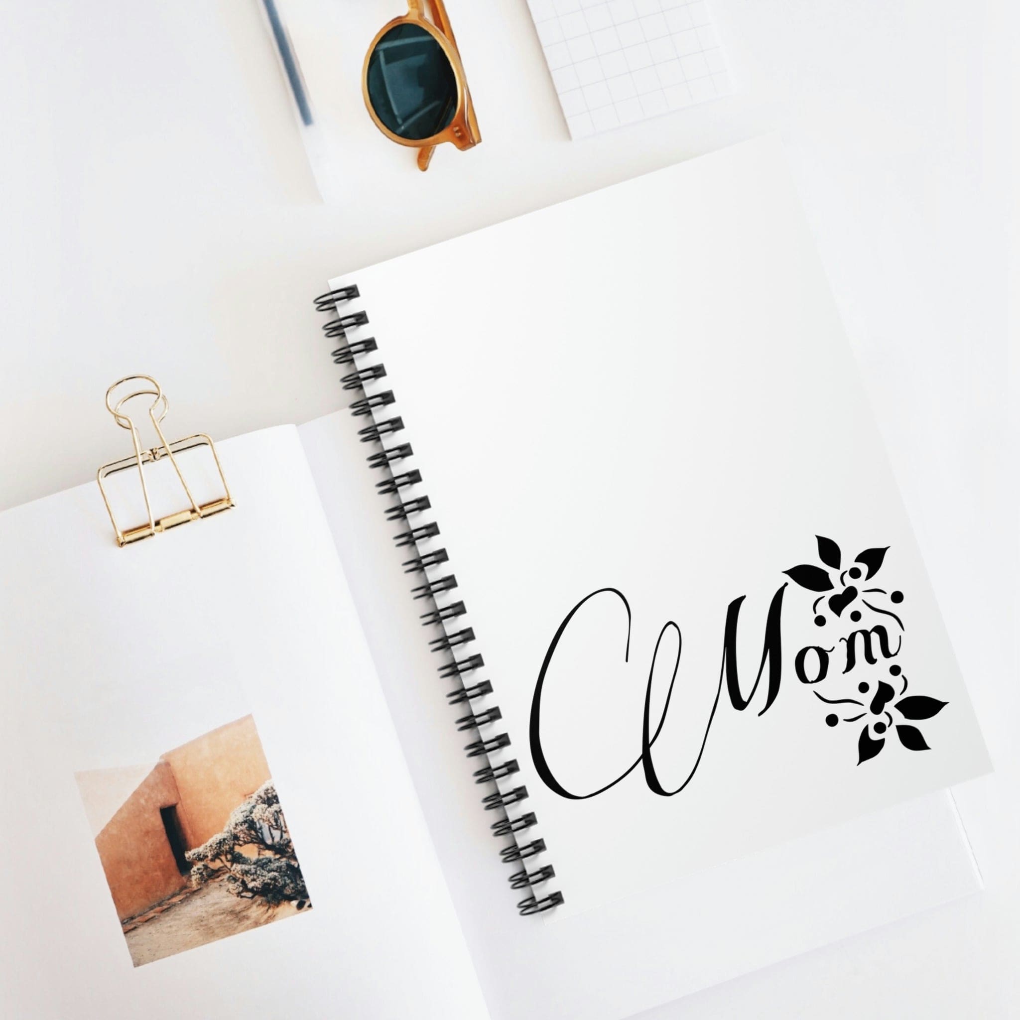 Spiral notebook featuring a Mom graphic on the cover, showcasing ruled line pages and a durable design.