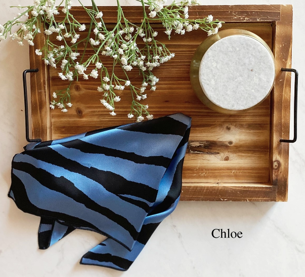 A stylish Square Satin Scarf in various vibrant patterns, showcasing its luxurious satin finish and versatility.