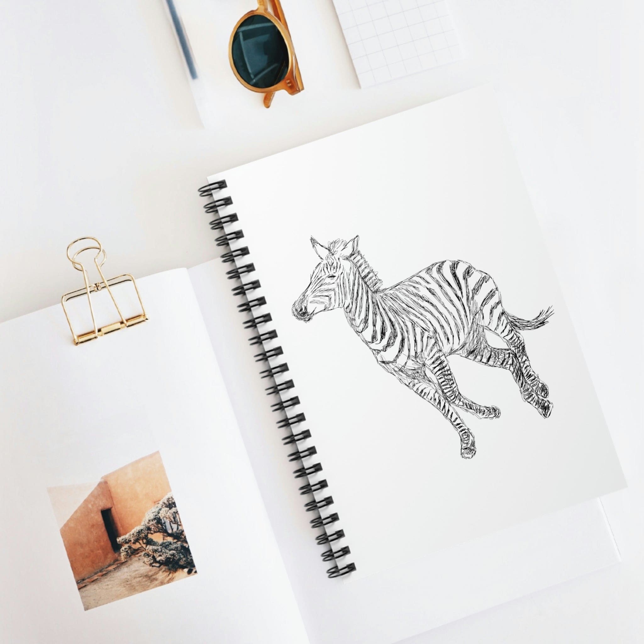 Spiral White Journal Notebook featuring Galloping Zebra line art on a durable cover, showcasing a stylish design for everyday use.