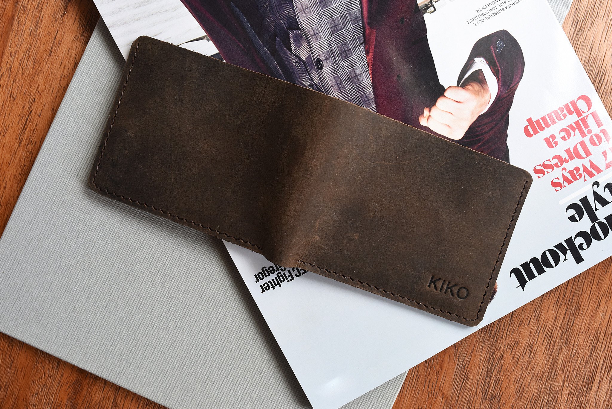 Step Up Wallet showcasing four card slots and a bill compartment in rich leather with dark stitching.