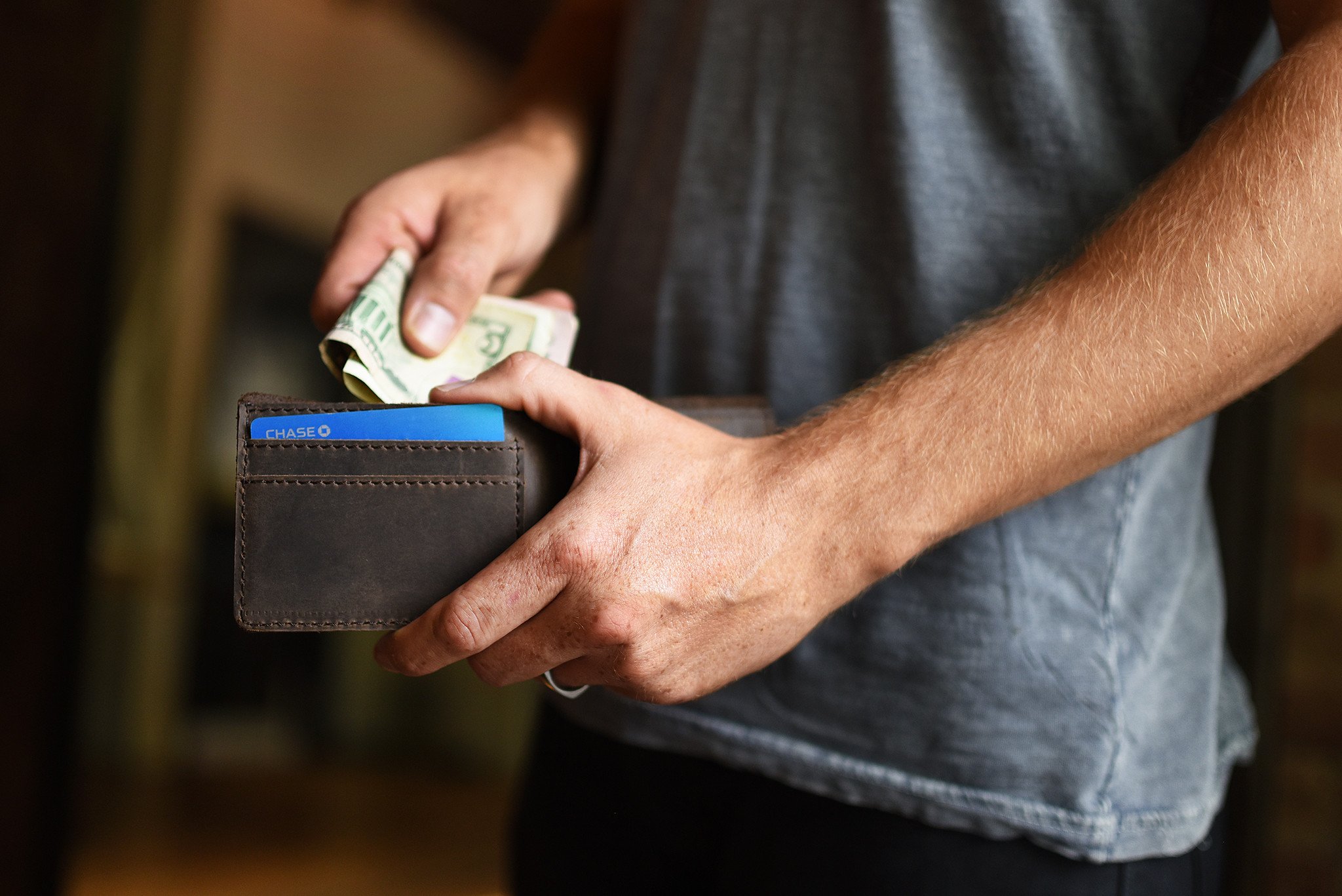 Step Up Wallet showcasing four card slots and a bill compartment in rich leather with dark stitching.