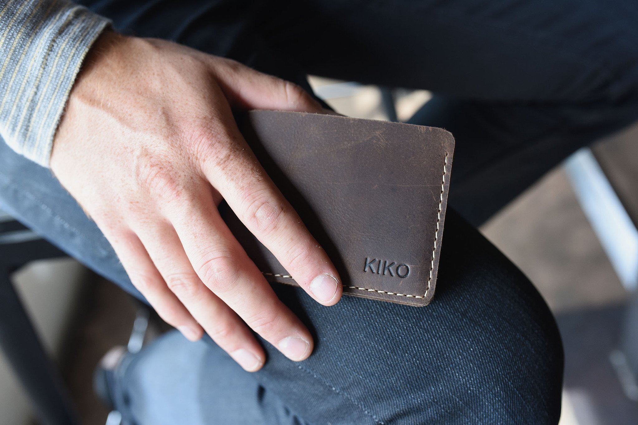 Straight Cut Bifold wallet made of high-quality leather with rustic dark brown color and antique-style wear spots.