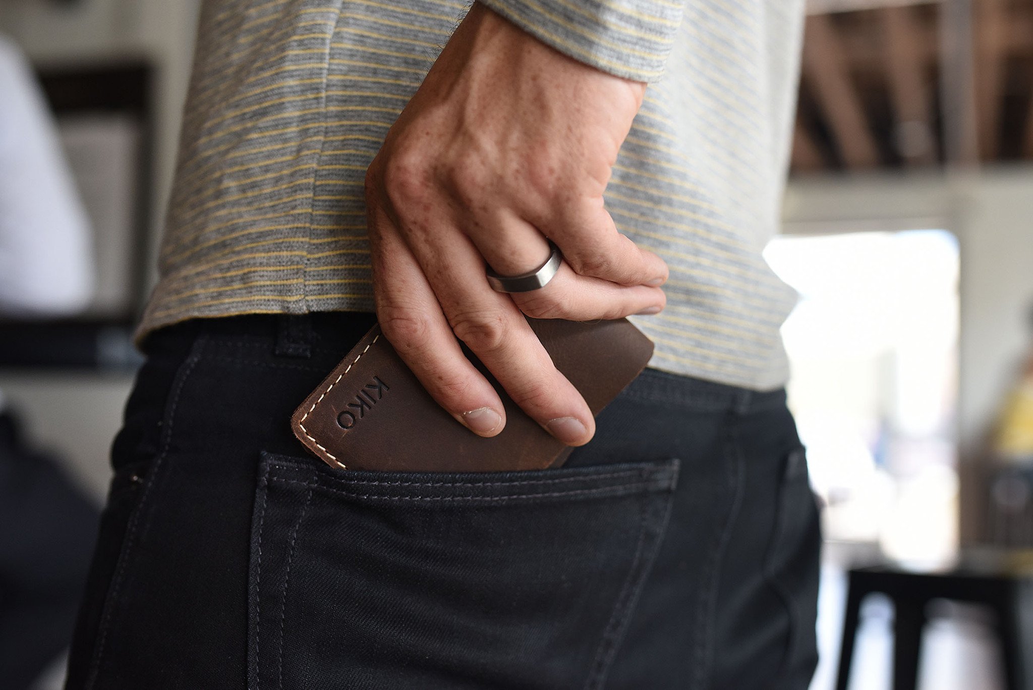 Straight Cut Bifold wallet made of high-quality leather with rustic dark brown color and antique-style wear spots.