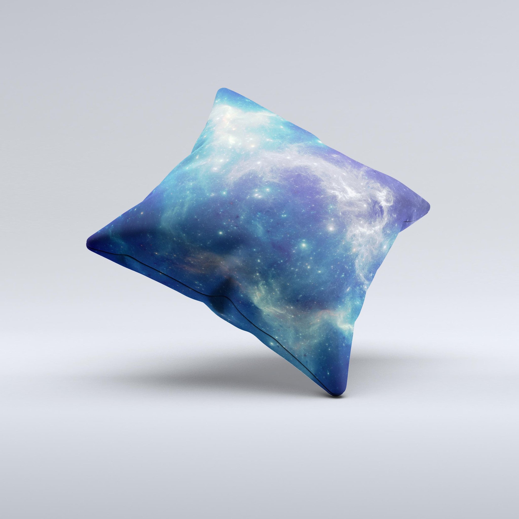 A decorative throw pillow featuring a subtle blue and green nebula design, handcrafted in Virginia with high thread count fabric and polyester filling.