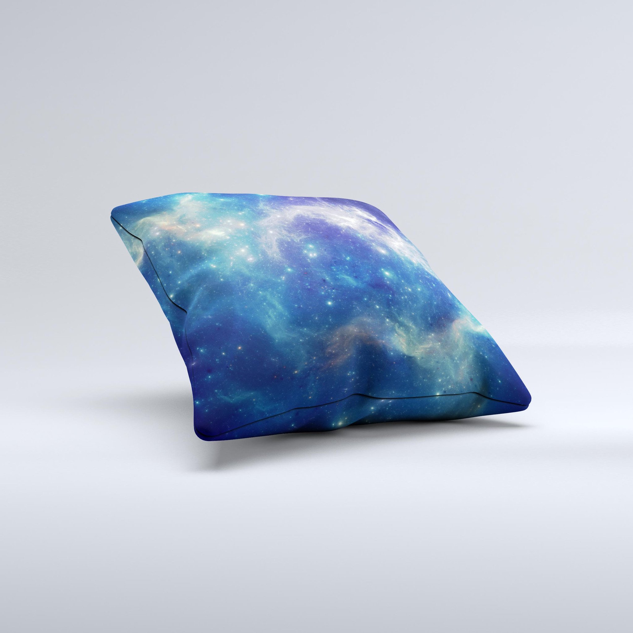 A decorative throw pillow featuring a subtle blue and green nebula design, handcrafted in Virginia with high thread count fabric and polyester filling.