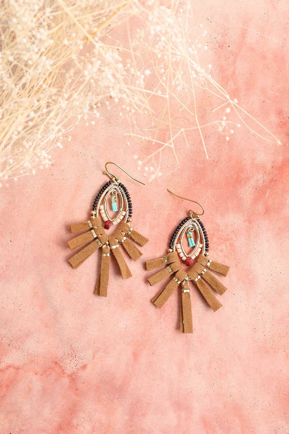 A pair of stylish suede fringe beaded earrings featuring colorful beads and a playful design, perfect for any outfit.