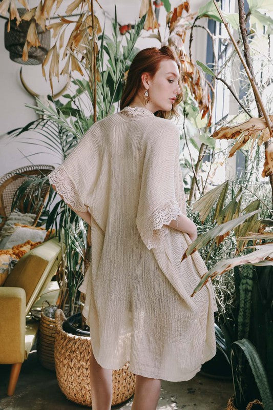 A stylish Sunshine Lace Trim Kimono featuring crochet scalloped lace trim in a solid color, perfect for summer layering.