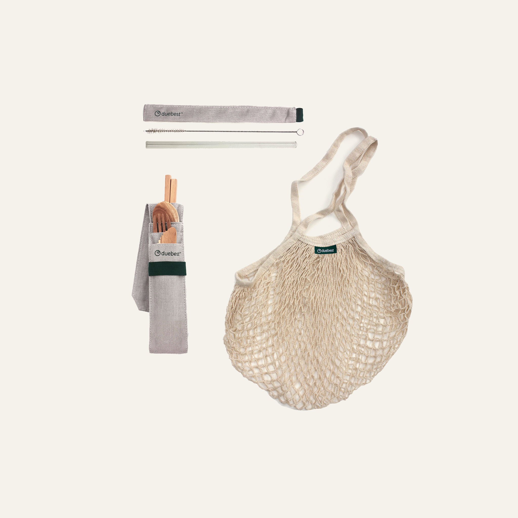 Sustainable Starter Gift Set featuring wooden cutlery, glass straw, and mesh bag, all designed for eco-friendly living.