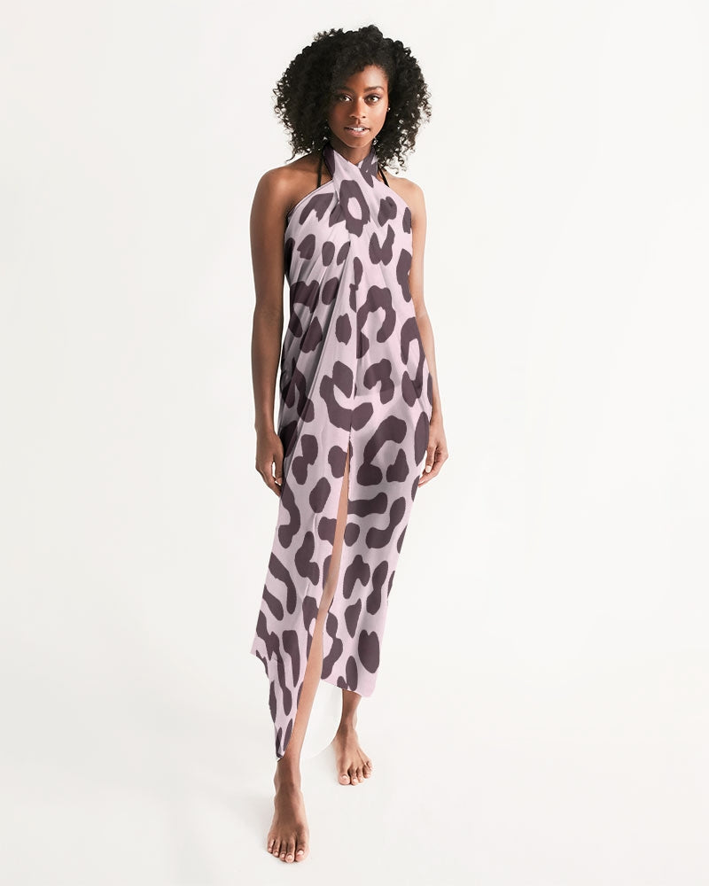 A stylish pink leopard print swim cover up draped elegantly, showcasing its lightweight and flowy fabric.