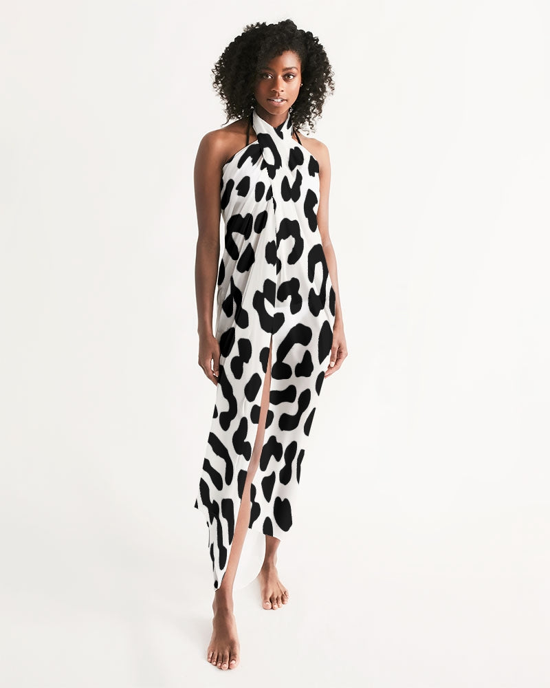 Black and white leopard print swim cover up draped elegantly, showcasing its lightweight fabric and self-tie closure.