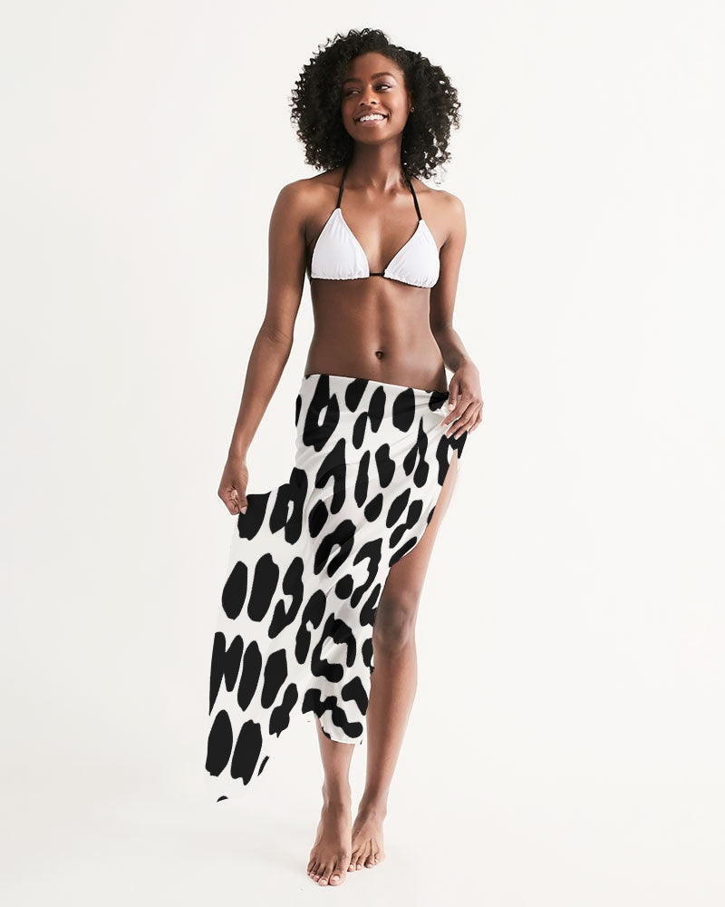 Black and white leopard print swim cover up draped elegantly, showcasing its lightweight fabric and self-tie closure.