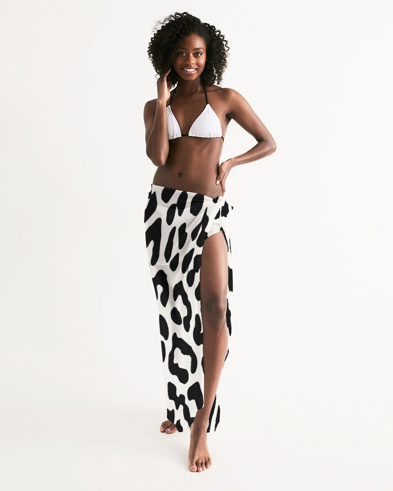 Black and white leopard print swim cover up draped elegantly, showcasing its lightweight fabric and self-tie closure.