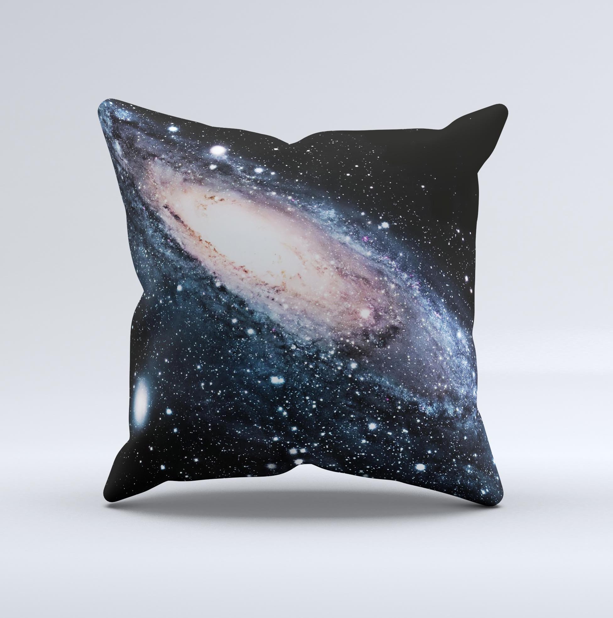 A decorative throw pillow featuring a swirling galaxy design with glowing stars, showcasing vibrant colors and a unique handcrafted appearance.