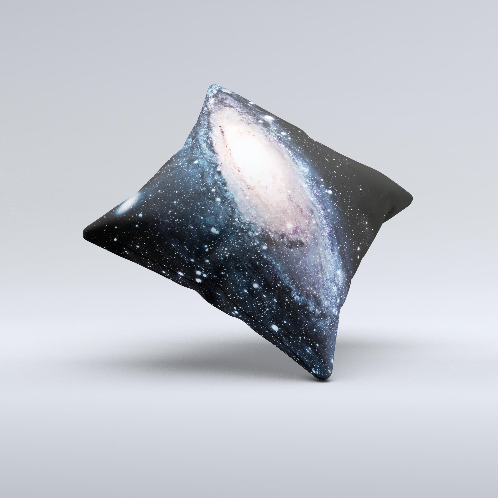 A decorative throw pillow featuring a swirling galaxy design with glowing stars, showcasing vibrant colors and a unique handcrafted appearance.