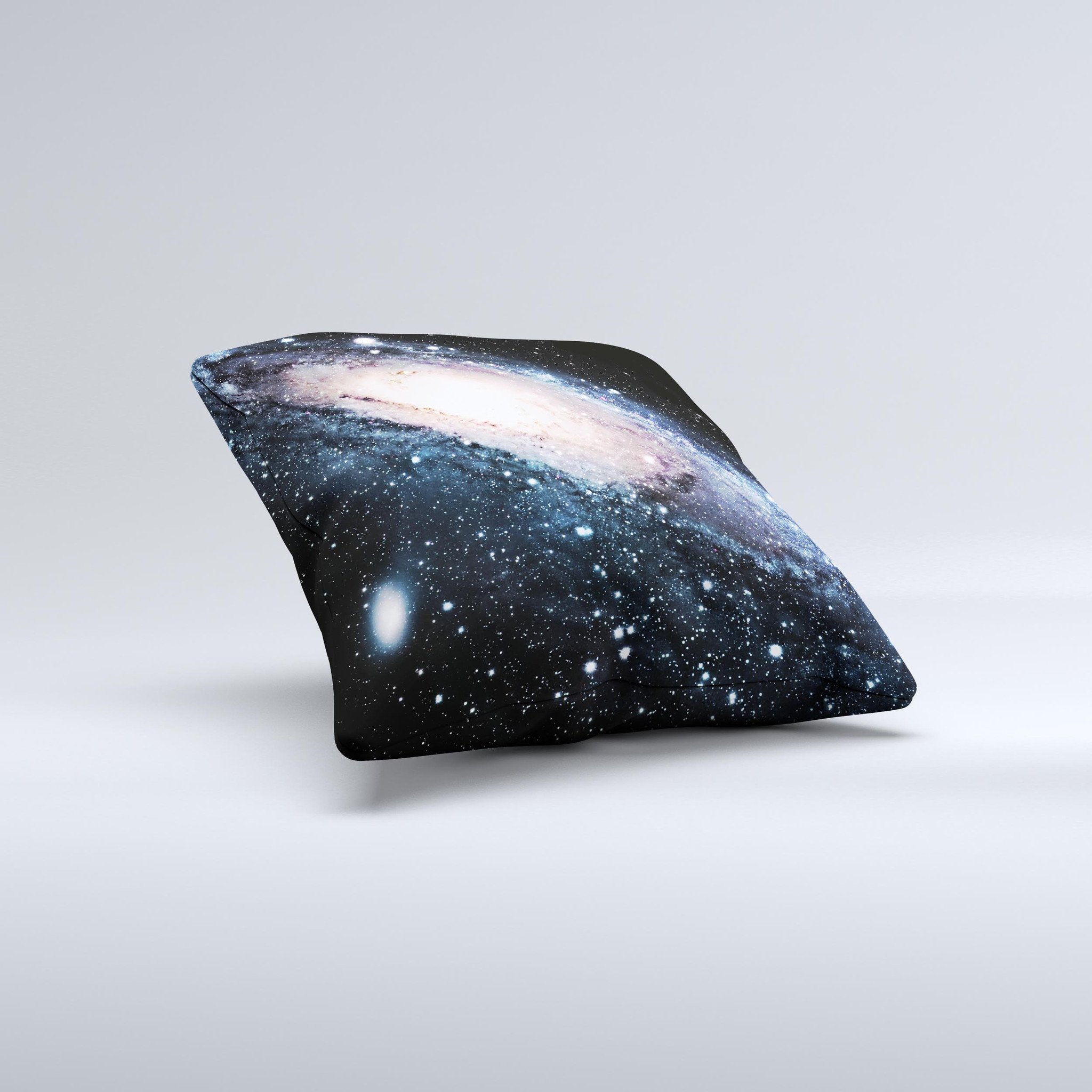 A decorative throw pillow featuring a swirling galaxy design with glowing stars, showcasing vibrant colors and a unique handcrafted appearance.