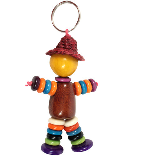 Colorful Tagua Nut Key Chain shaped like a doll, featuring a charming hat, showcasing unique patterns and eco-friendly craftsmanship.