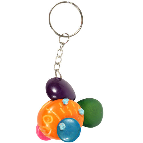 Handmade Tagua Nut Key Chain shaped like a fish, showcasing unique colors and patterns, eco-friendly and sustainable.