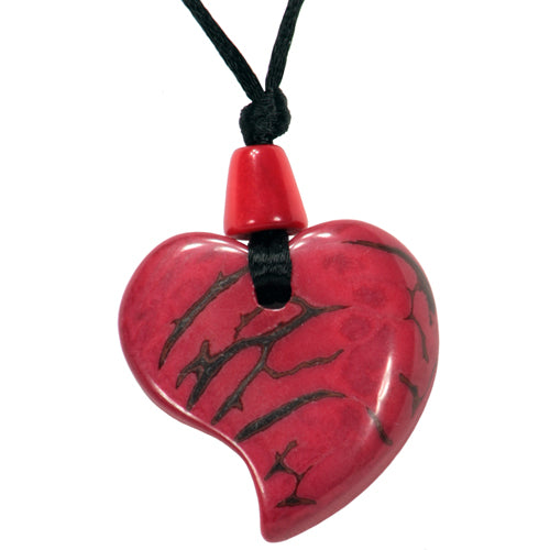 Handcrafted Tagua Nut Red Raindrop Pendant showcasing vibrant red color and unique raindrop shape, symbolizing sustainable fashion.