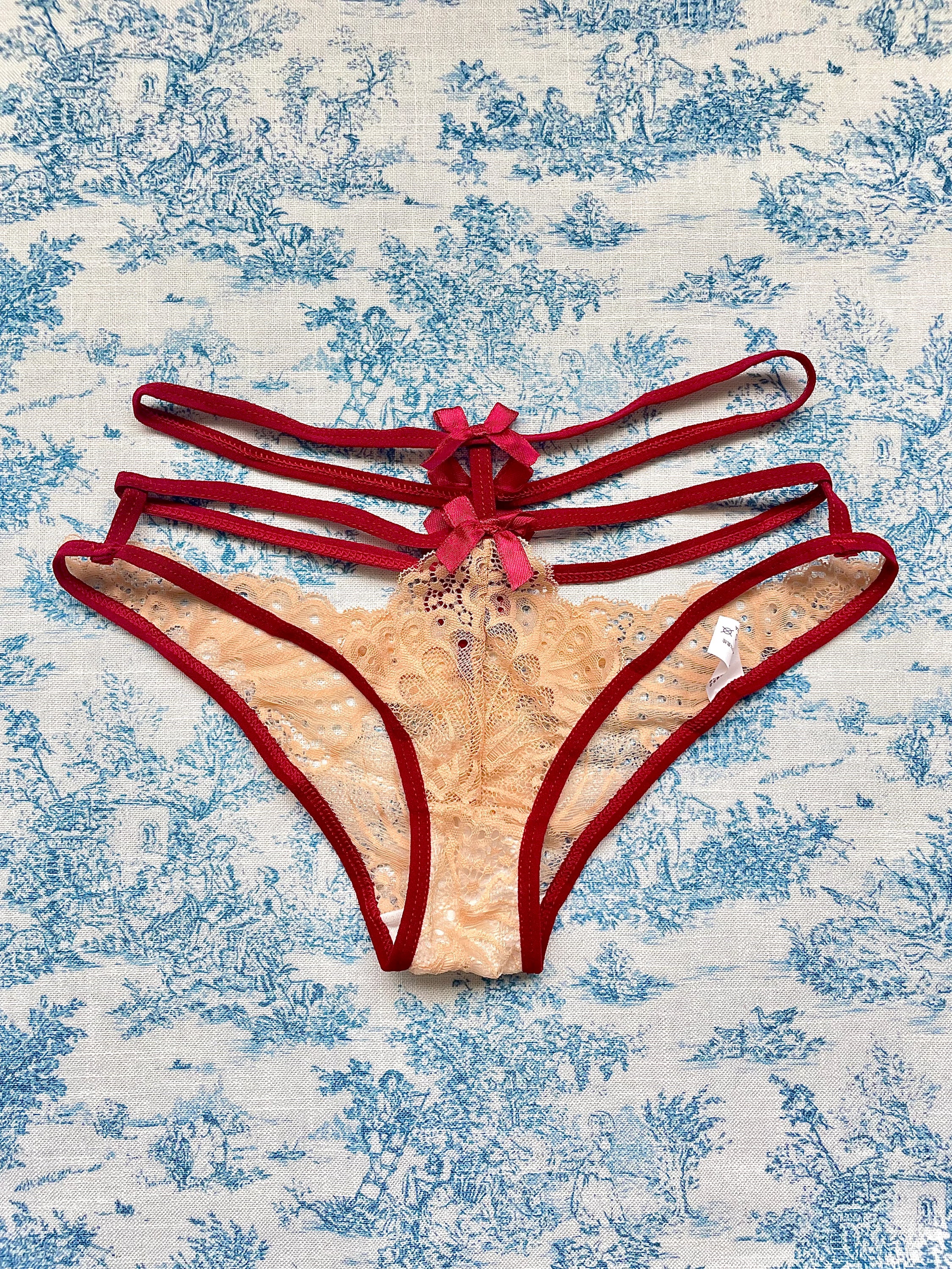 Tan and red straps bow panty featuring delicate lace and playful bow details, designed for comfort and style.