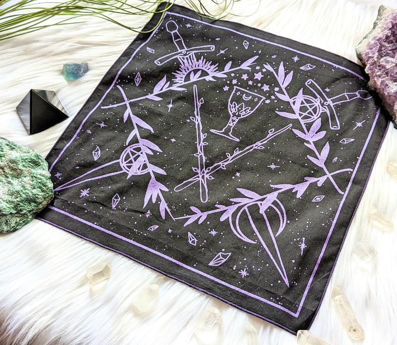 Tarot Altar Cloth featuring original artwork of the four tarot suits, made from eco-friendly materials, measuring 12x12 inches.