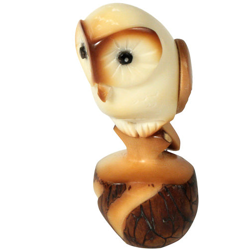 Hand-carved Tawny Owl figurine made from tagua nut, showcasing intricate details and natural colors, symbolizing eco-friendly craftsmanship.