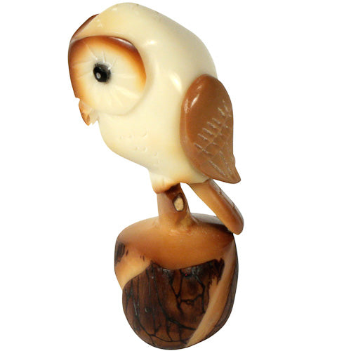 Hand-carved Tawny Owl figurine made from tagua nut, showcasing intricate details and natural colors, symbolizing eco-friendly craftsmanship.