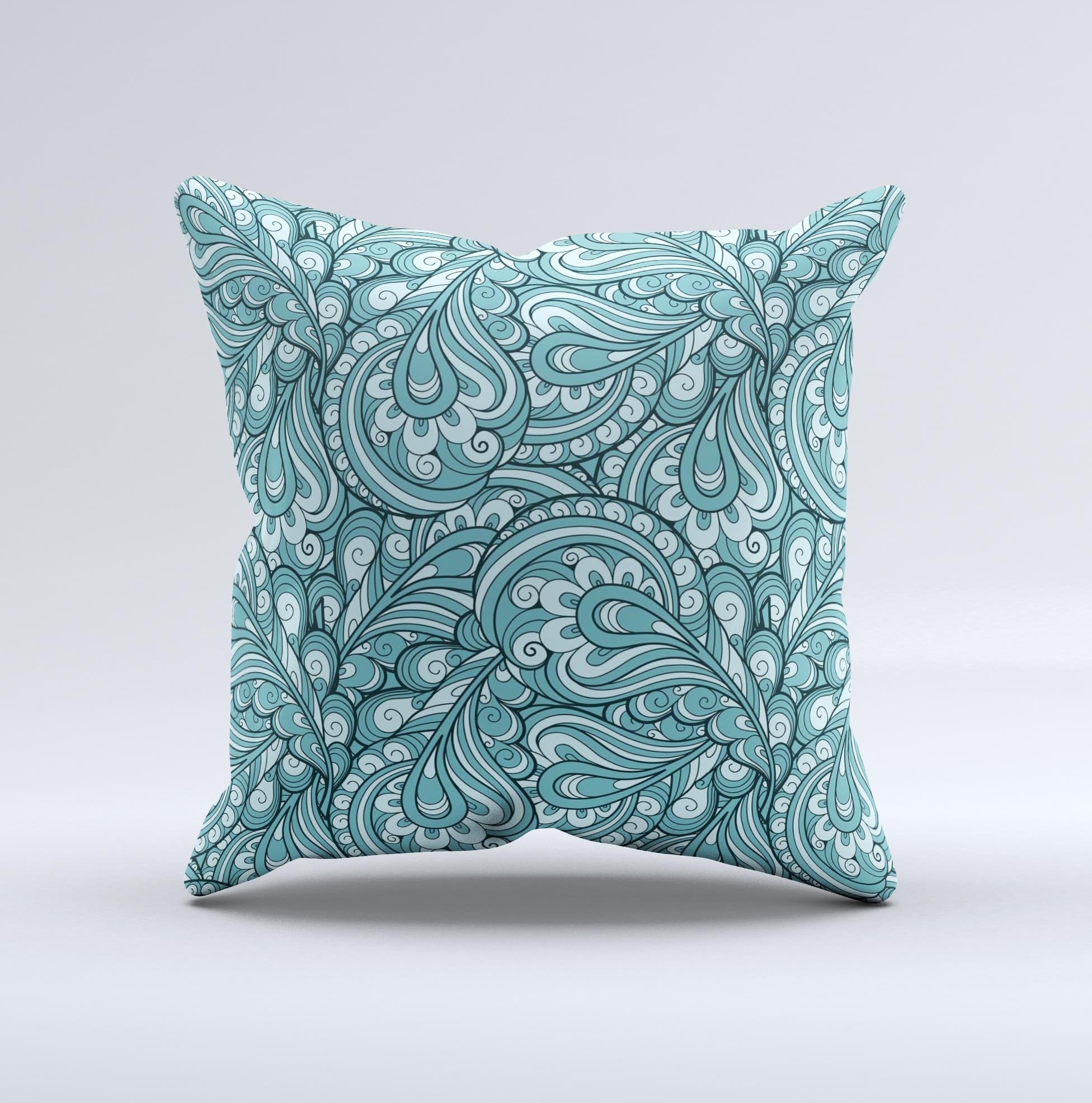 Teal decorative throw pillow featuring a floral paisley pattern, showcasing vibrant colors and intricate designs, perfect for home decor.