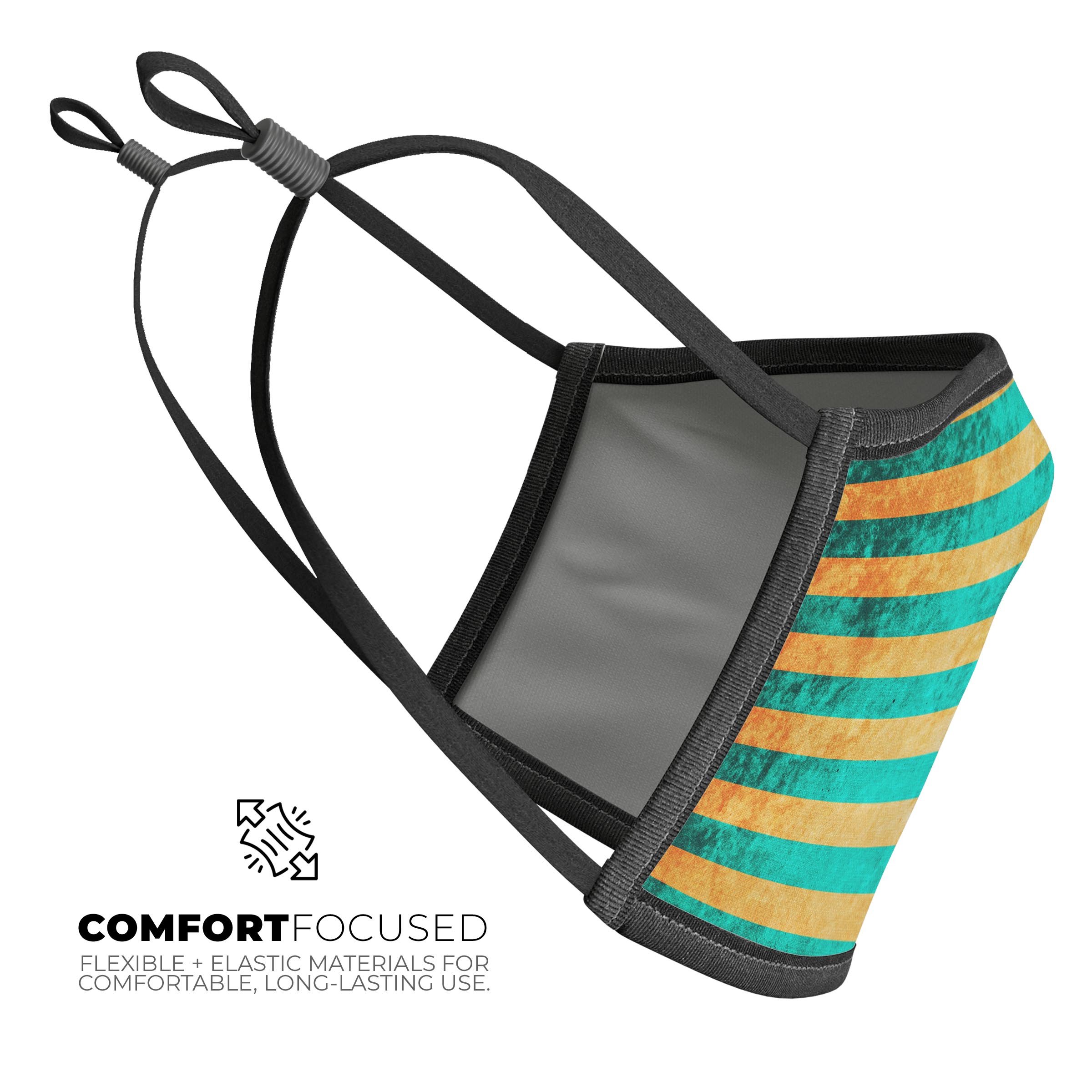 Teal green face mask with vertical gold stripes, showcasing adjustable ear loops and soft cotton interior.