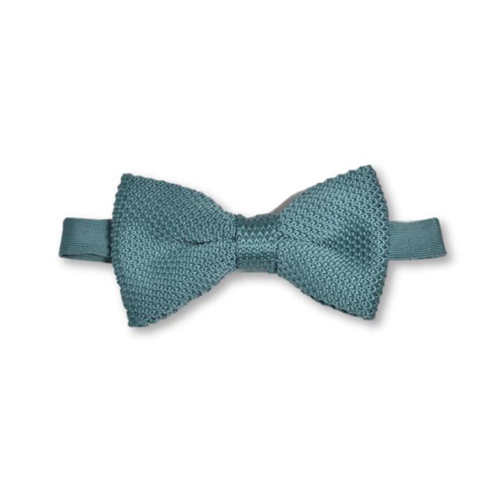 Teal knitted bow tie displayed on a white background, showcasing its unique texture and vibrant color.