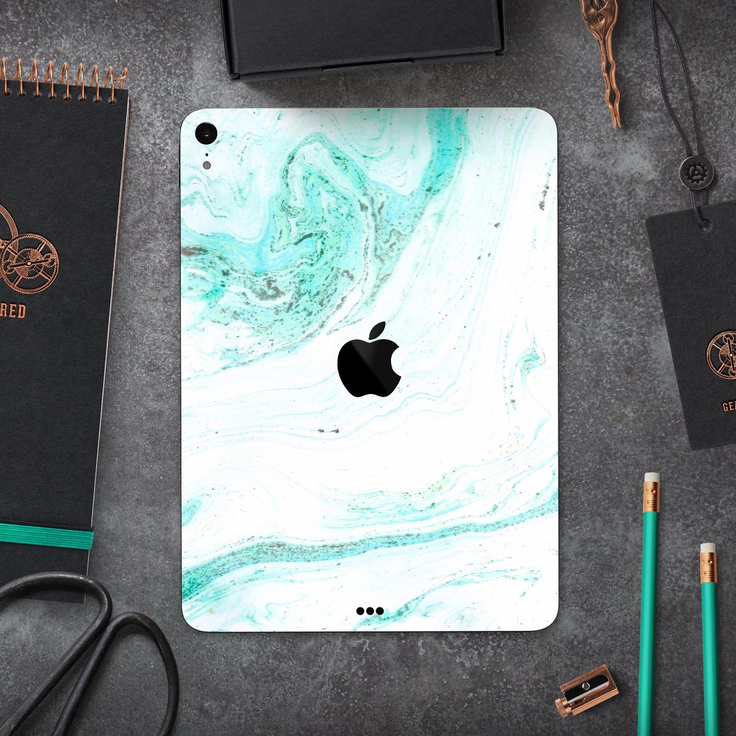 Teal v4 Textured Marble skin decal for Apple iPad Pro, showcasing a stylish marble design with a smooth finish.