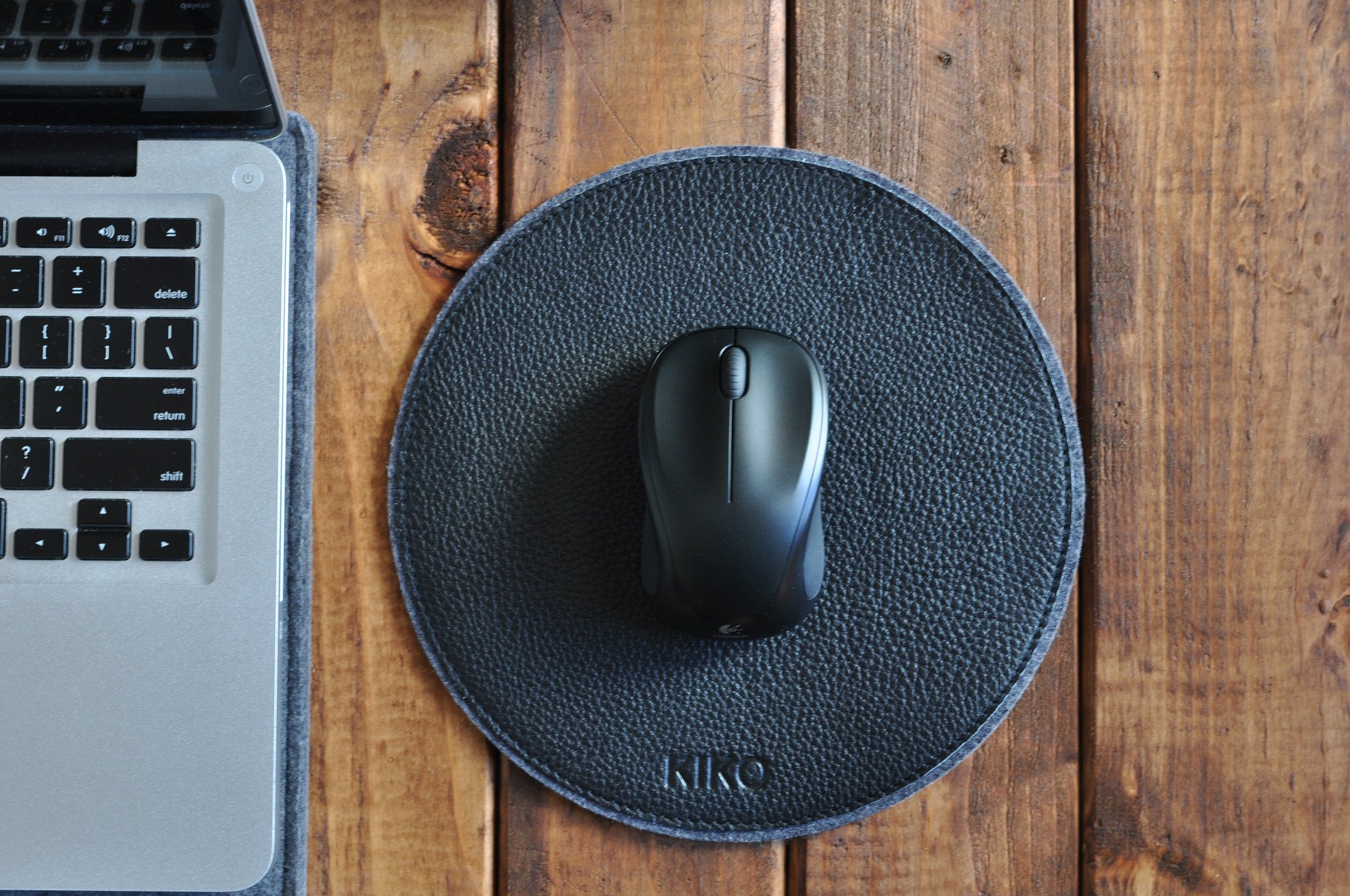 Elegant leather and wool felt Tech Pad with heat burnished details, perfect for mouse use and protecting tech devices.