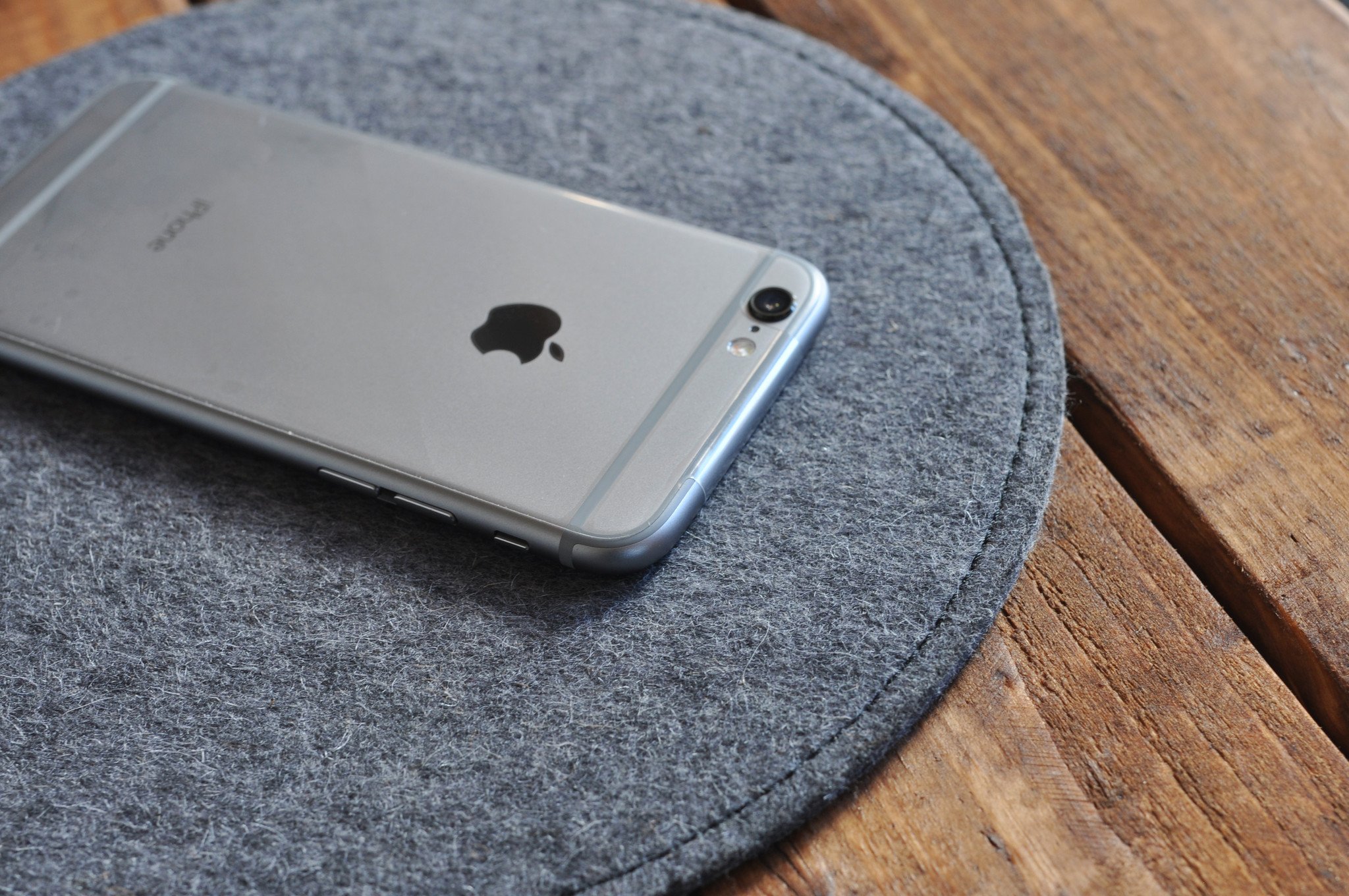 Elegant leather and wool felt Tech Pad with heat burnished details, perfect for mouse use and protecting tech devices.