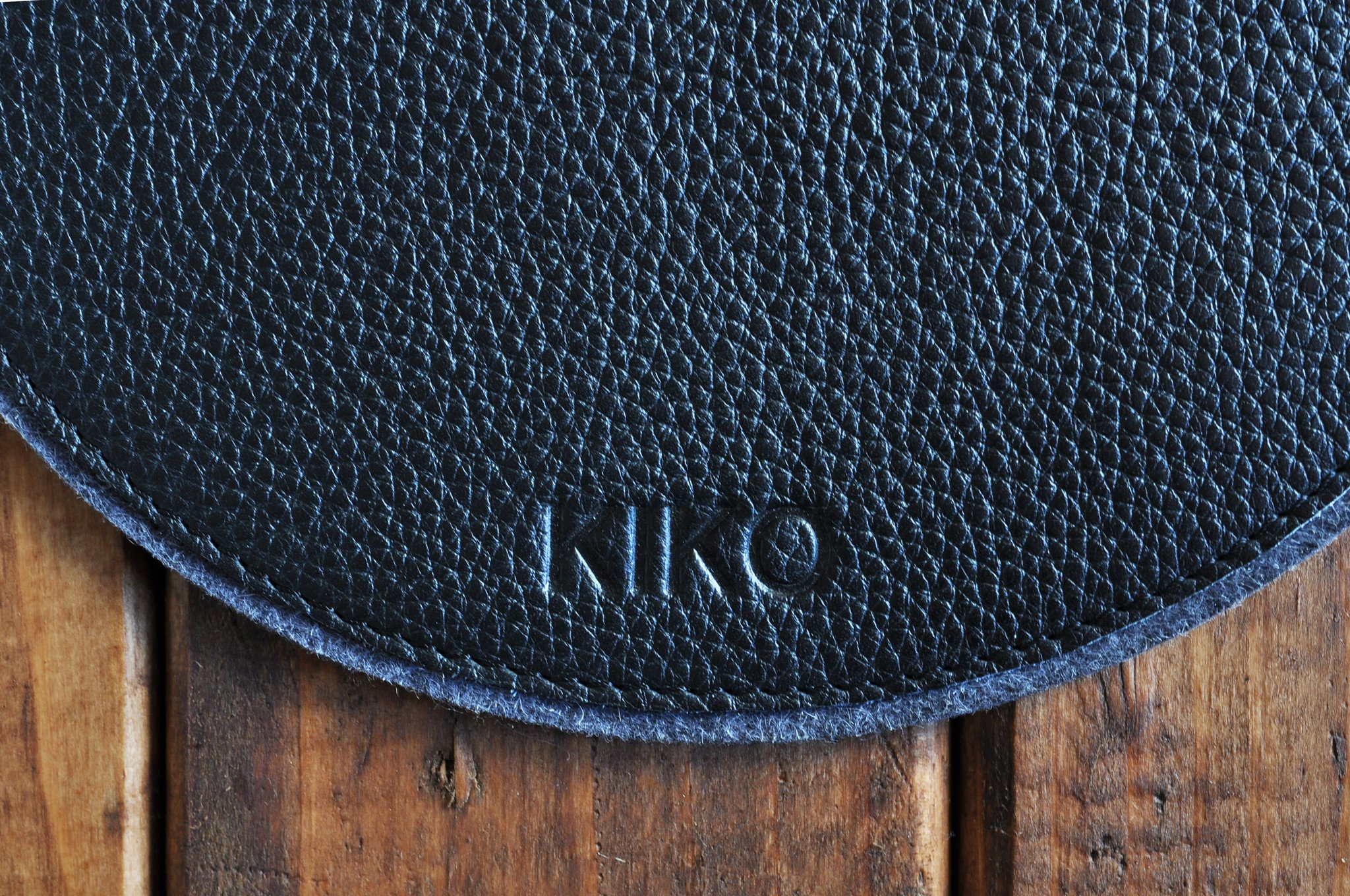 Elegant leather and wool felt Tech Pad with heat burnished details, perfect for mouse use and protecting tech devices.