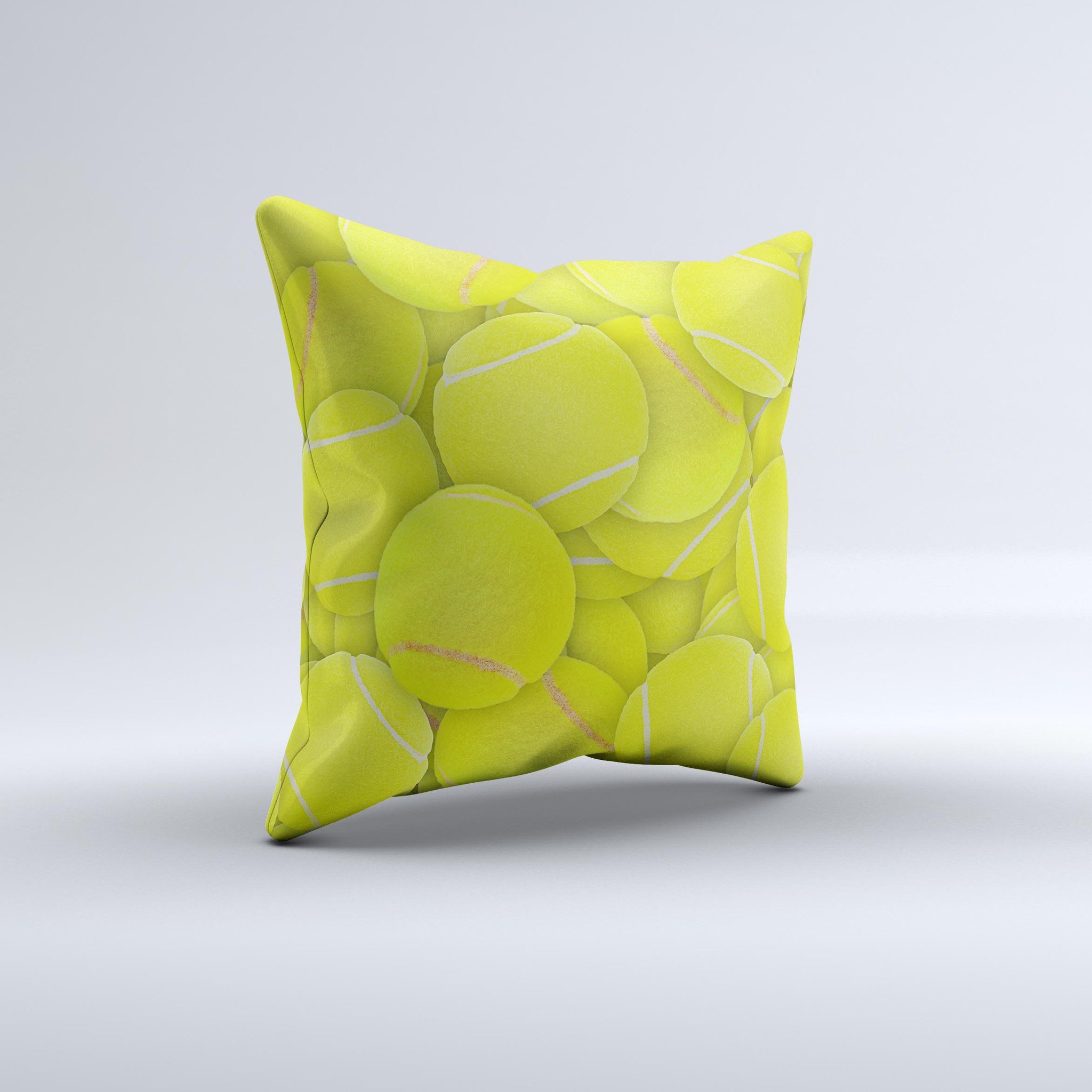 A decorative throw pillow featuring a vibrant tennis ball overlay design, handcrafted in Virginia with high-quality materials.