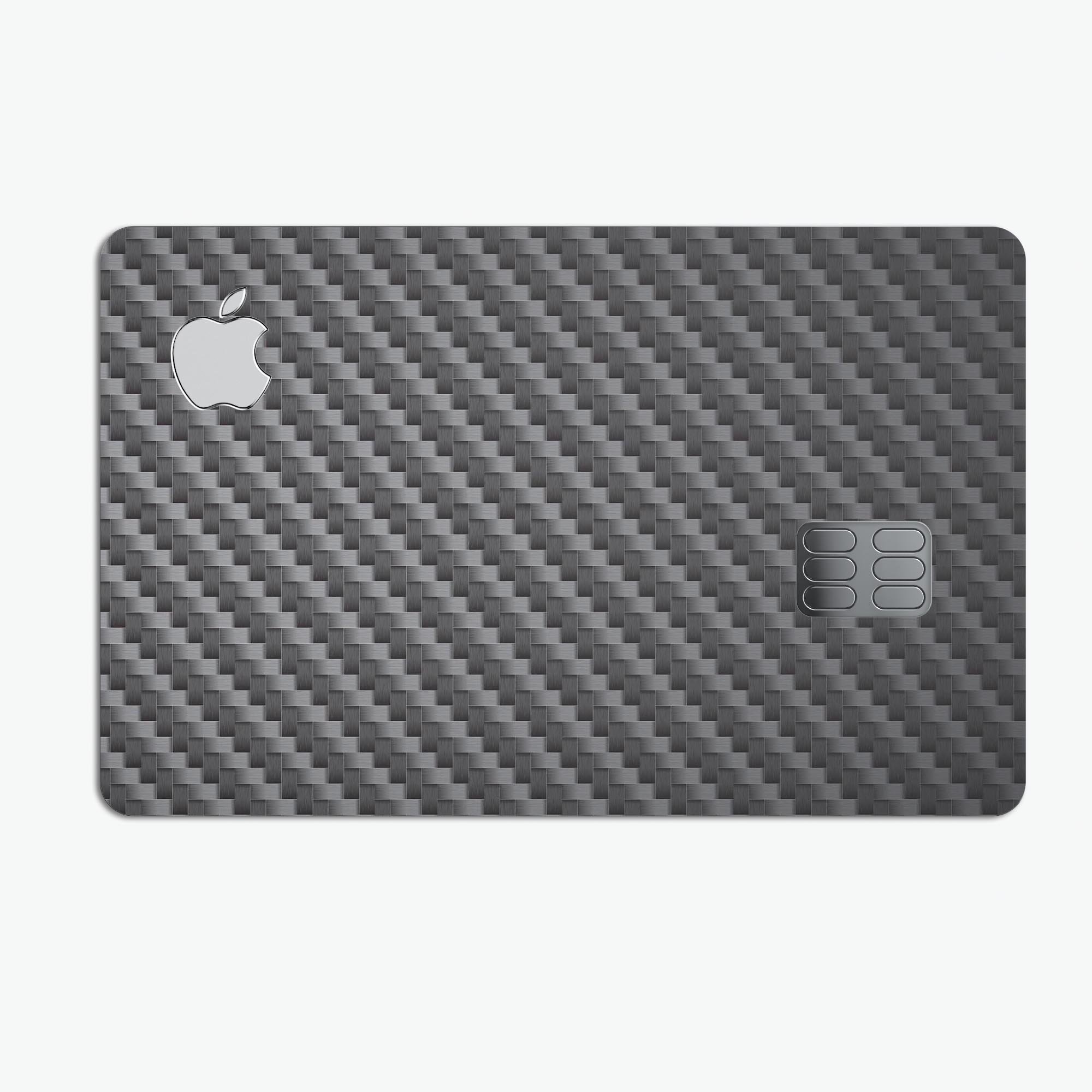 Textured black carbon fiber decal skin-kit for Apple Card, showcasing its premium finish and protective features.