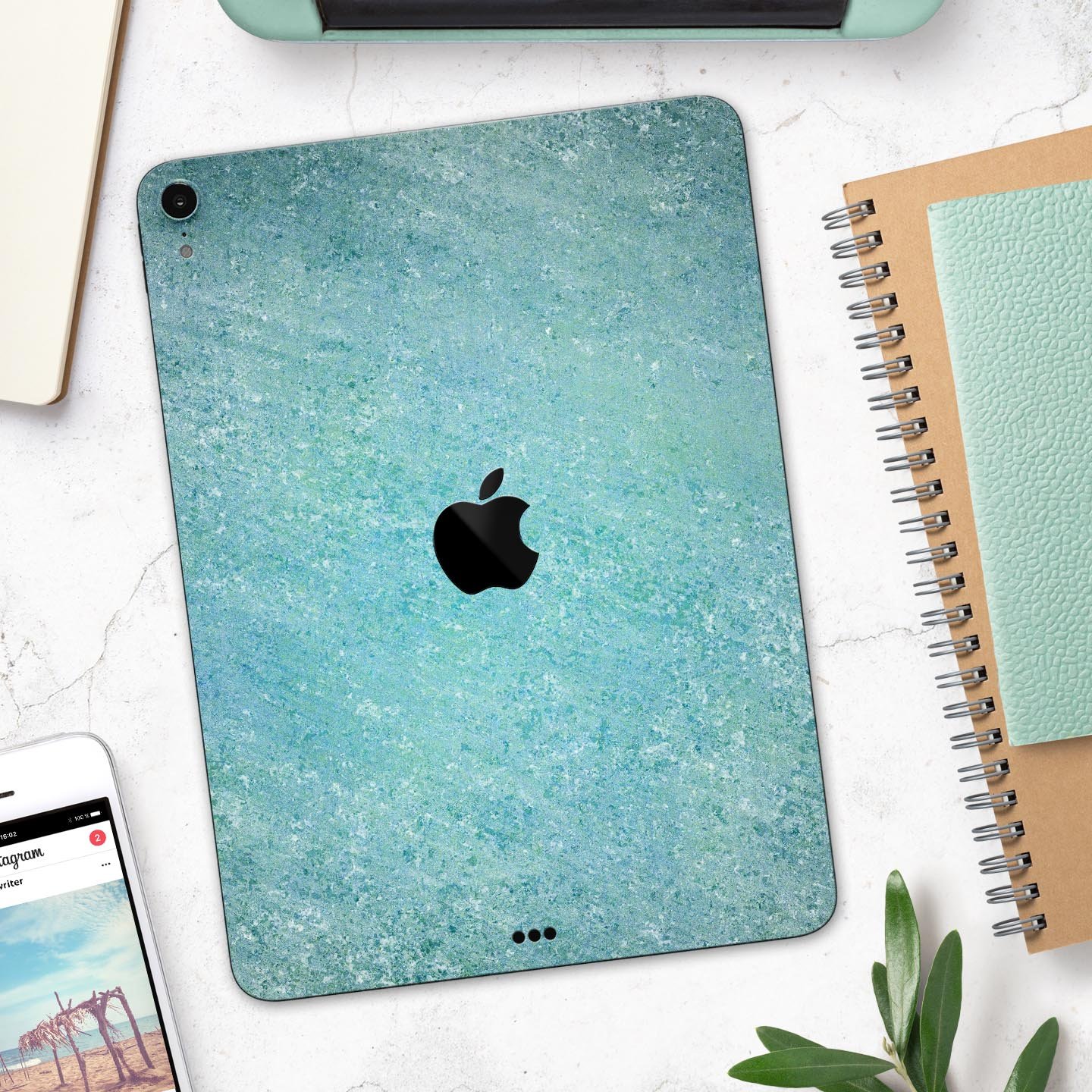 Textured teal surface skin decal for Apple iPad Pro, showcasing its premium quality and design.