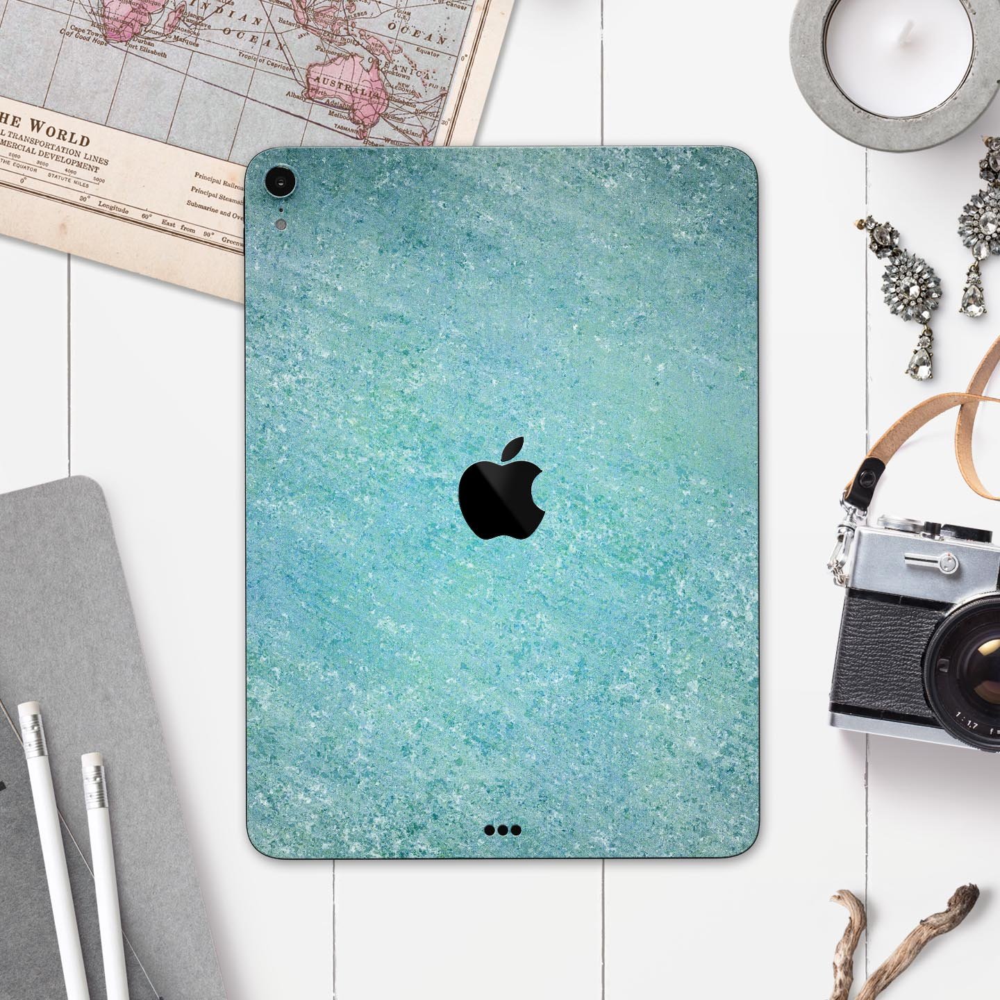 Textured teal surface skin decal for Apple iPad Pro, showcasing its premium quality and design.