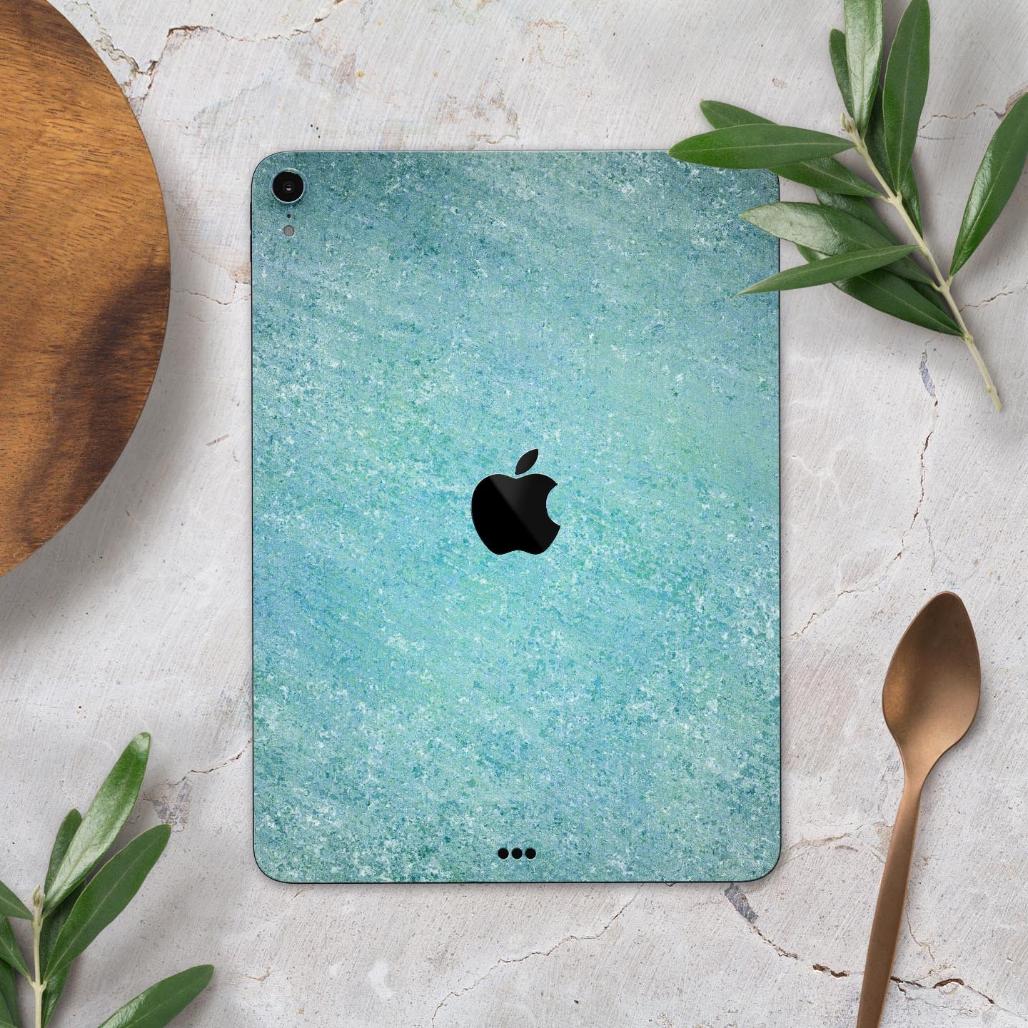 Textured teal surface skin decal for Apple iPad Pro, showcasing its premium quality and design.