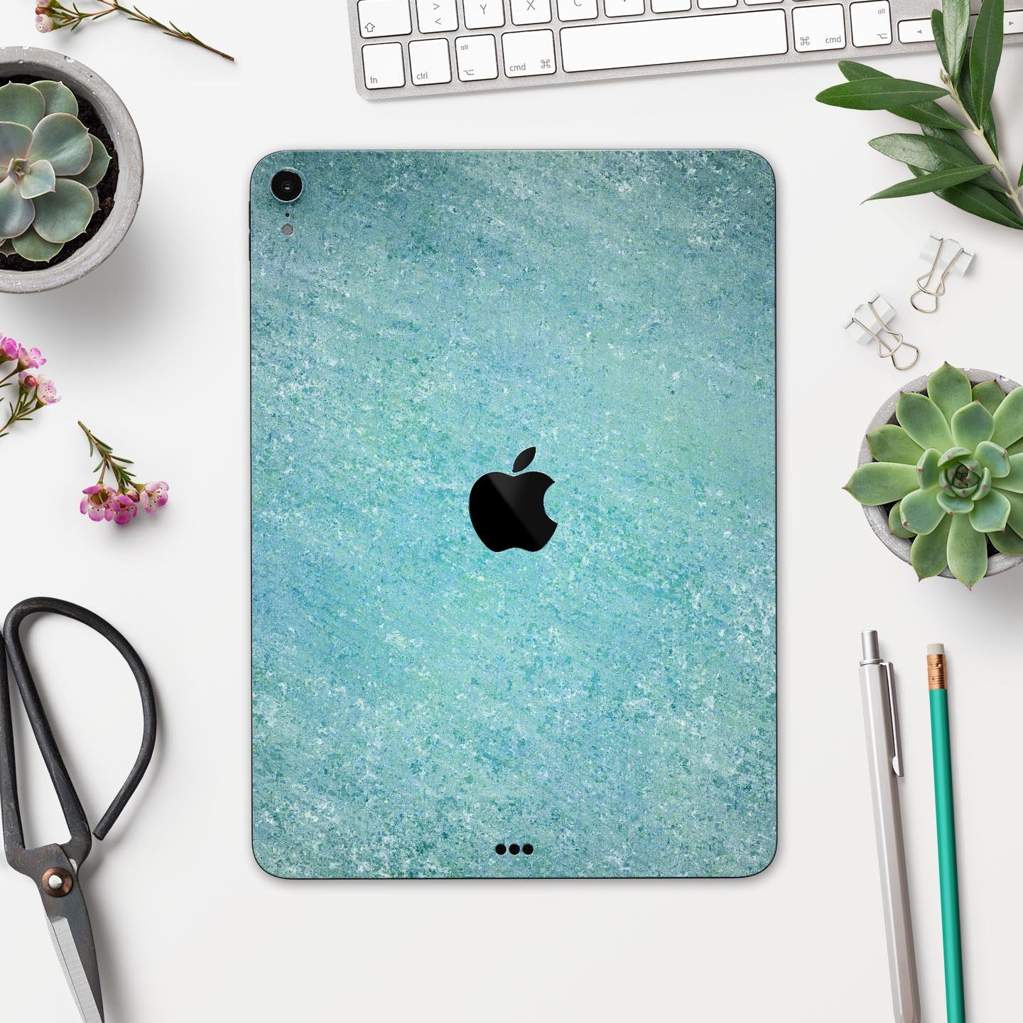 Textured teal surface skin decal for Apple iPad Pro, showcasing its premium quality and design.