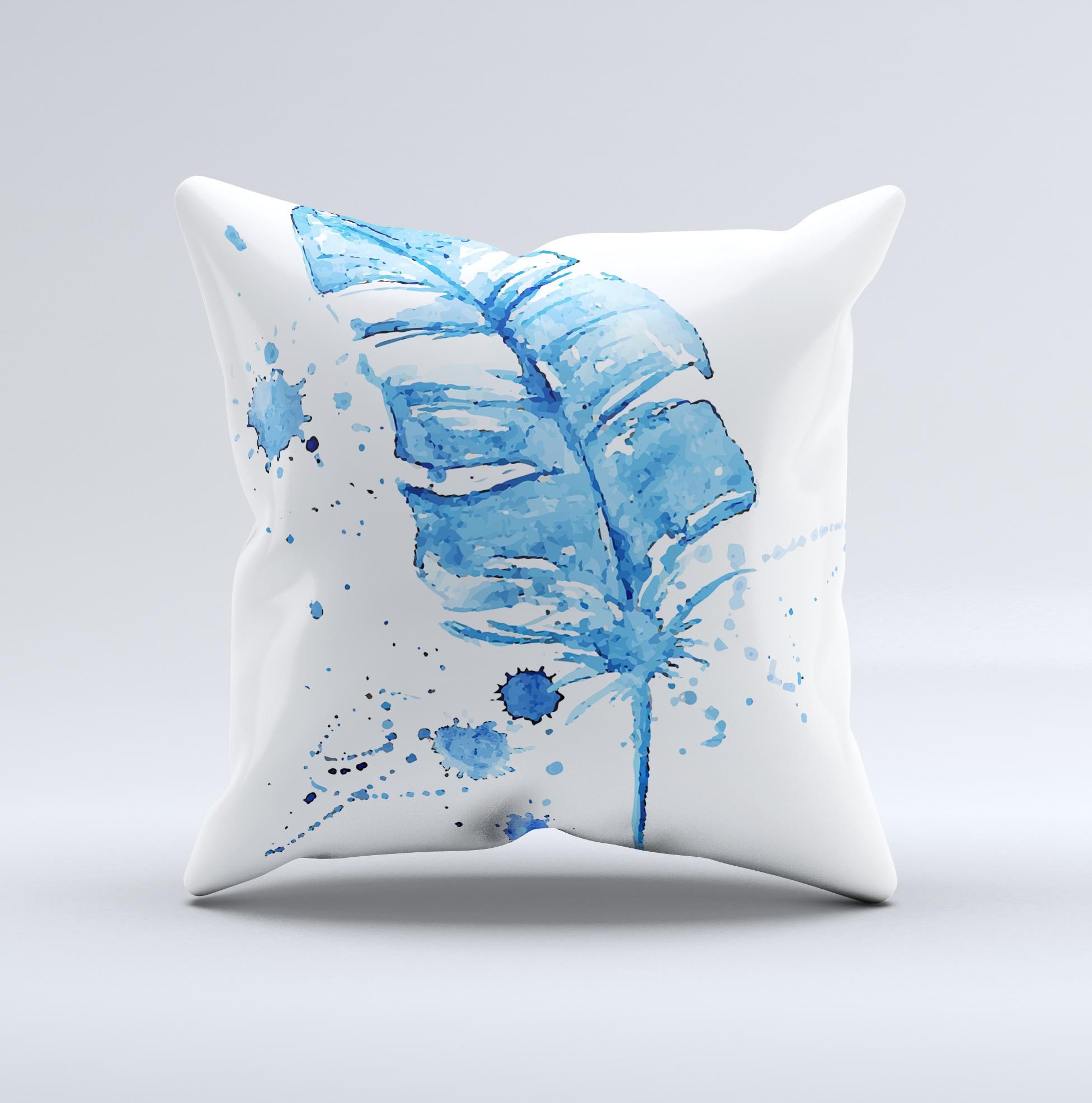 A vibrant Blue Splatter Feather ink-Fuzed Decorative Throw Pillow showcasing unique hand-produced graphics and high-quality fabric.