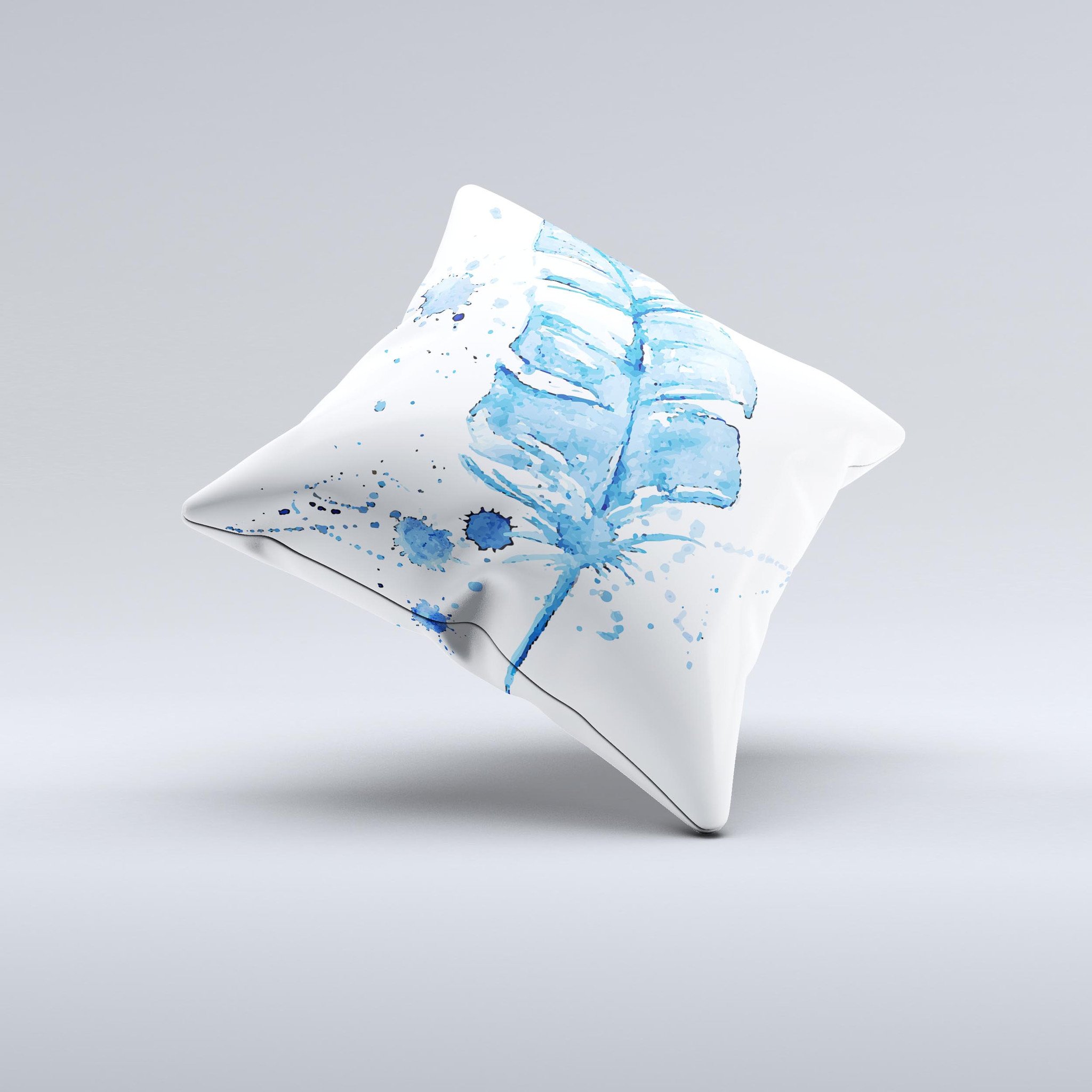 A vibrant Blue Splatter Feather ink-Fuzed Decorative Throw Pillow showcasing unique hand-produced graphics and high-quality fabric.