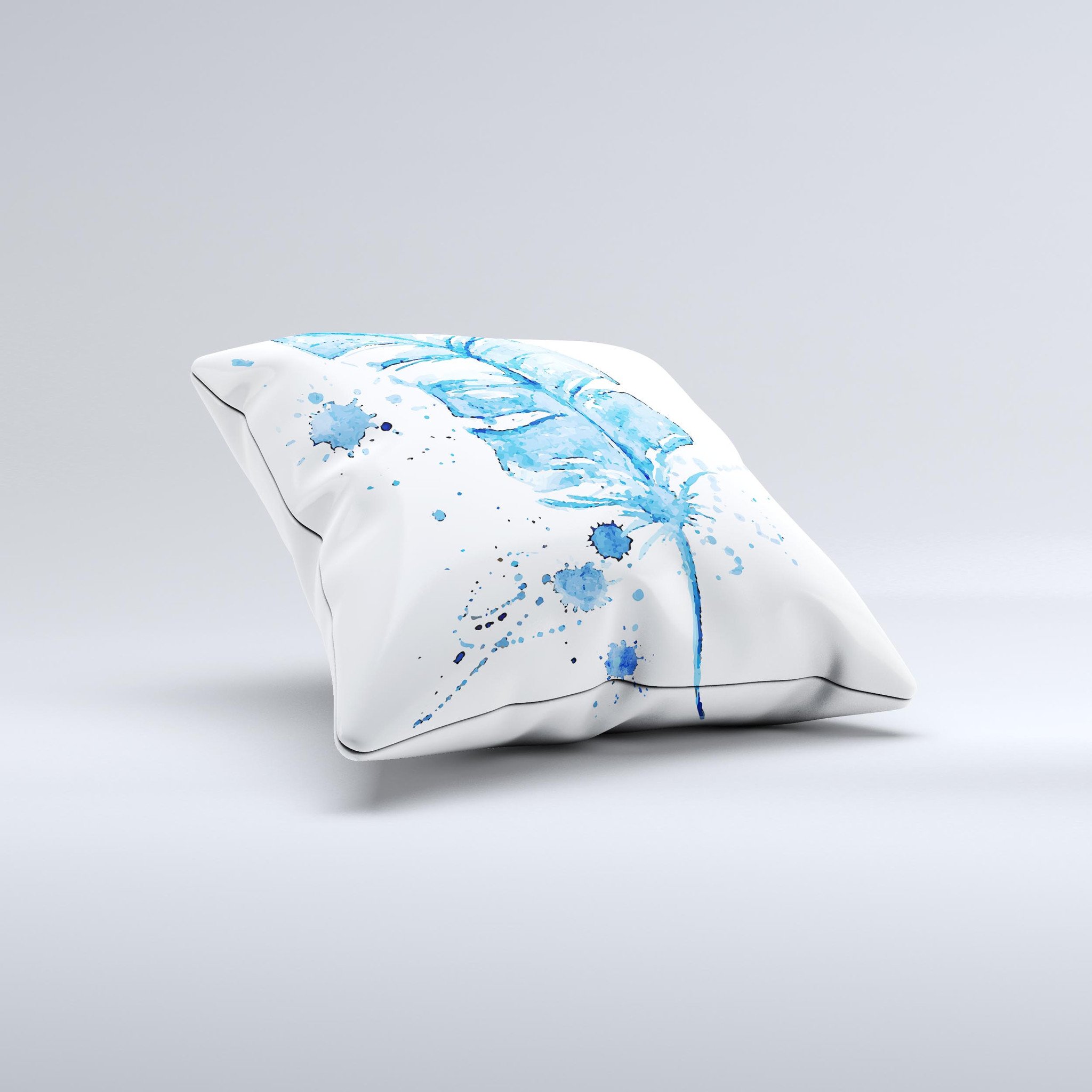 A vibrant Blue Splatter Feather ink-Fuzed Decorative Throw Pillow showcasing unique hand-produced graphics and high-quality fabric.