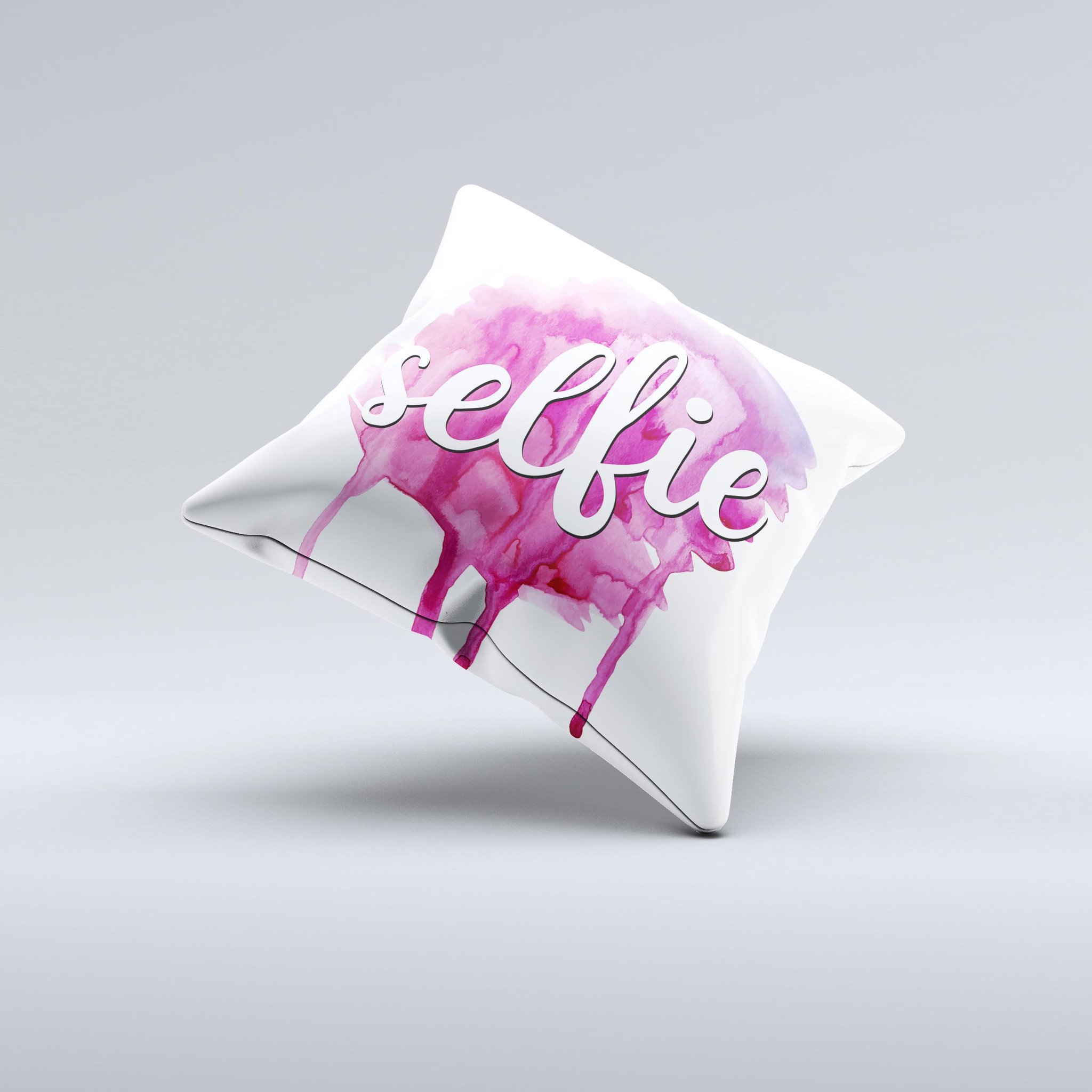 A vibrant decorative throw pillow featuring the phrase 'But First, Selfie' with a unique ink-fuzed design, handcrafted in Virginia.