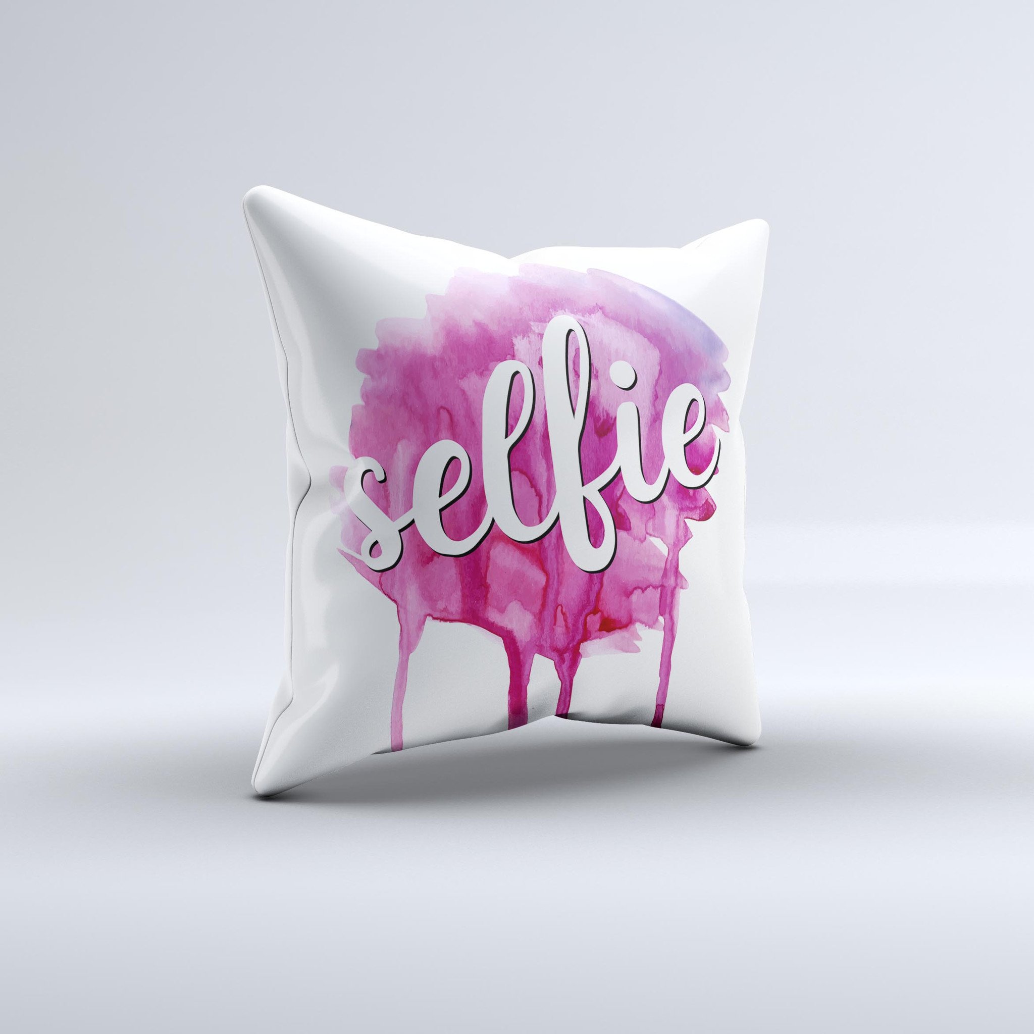 A vibrant decorative throw pillow featuring the phrase 'But First, Selfie' with a unique ink-fuzed design, handcrafted in Virginia.