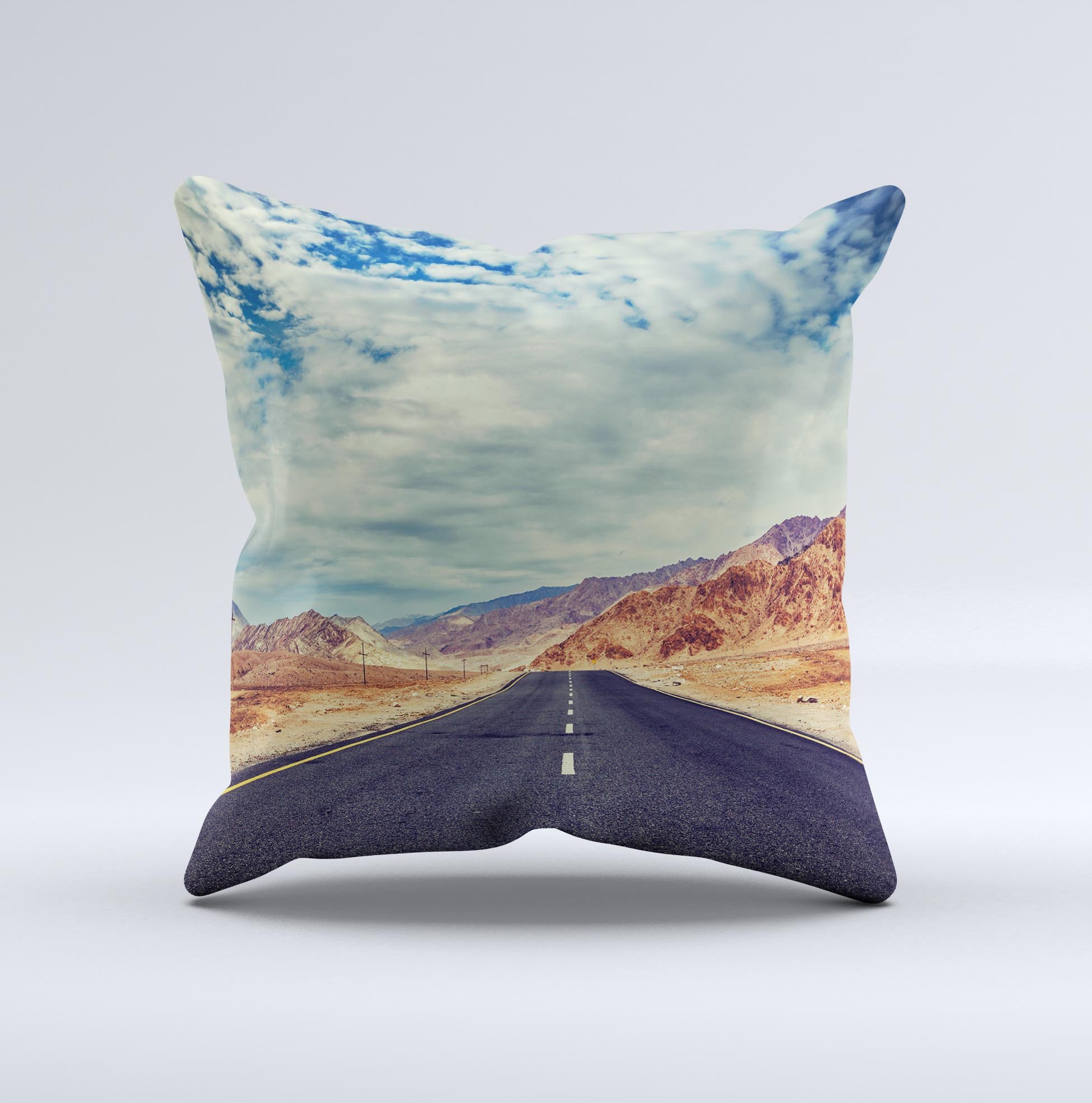 The Desert Road ink-Fuzed Decorative Throw Pillow featuring a unique handcrafted design with high thread count fabric and vibrant colors.